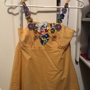 Yellow top with floral fabric detail